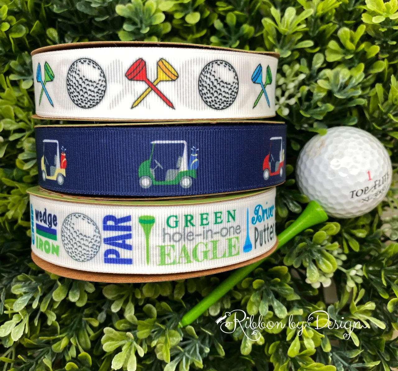 Golf carts in yellow, blue, red and green with golf clubs on a navy blue background printed on 7/8" white grosgrain